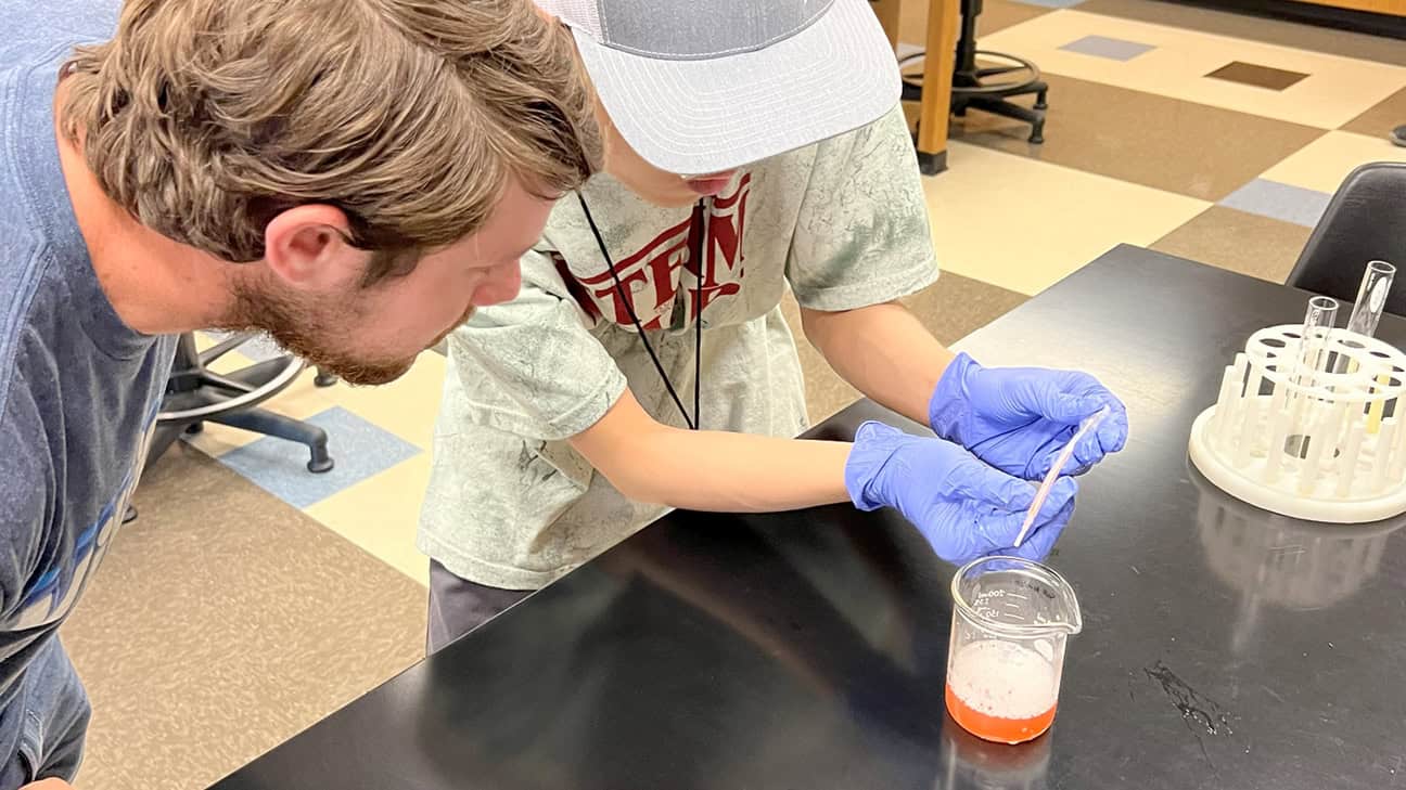 Teacher and student in a science lab