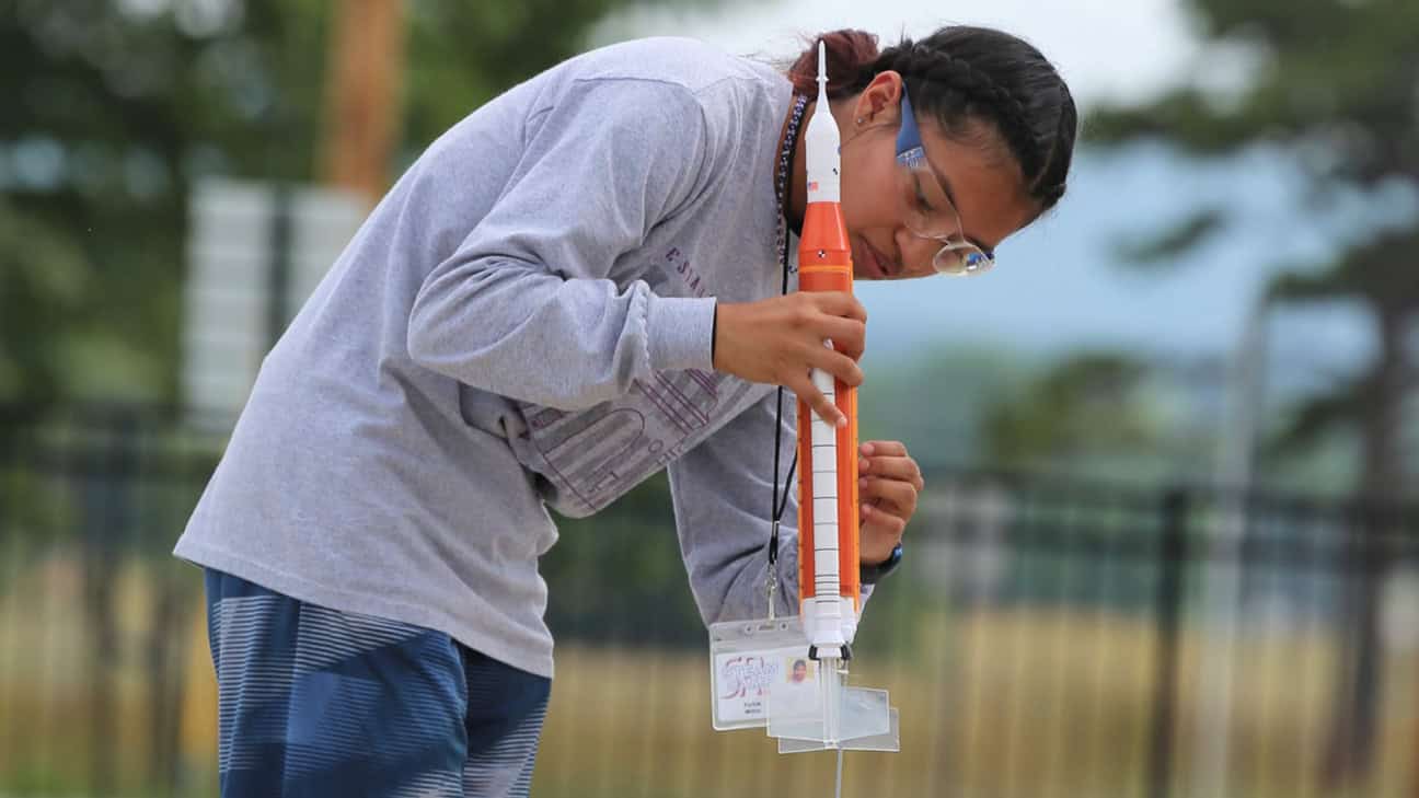 Senior high student launching a rocket