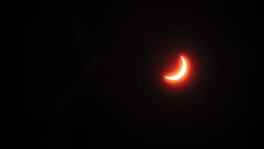 The moon moves in front of the sun and causes a crescent sun