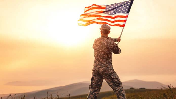 Veteran waving US flag