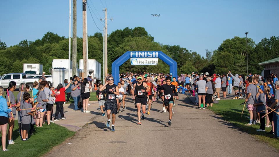 A group of runners race from the MMIW 5K starting line