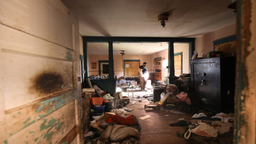 Josh Wilson stands inside his old house.
