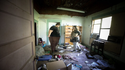Josh and Ashton Wilson stand inside their old house.