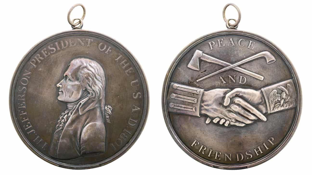 Photo of Indian Peace Medal with Thomas Jefferson on one side and shaking hands on the other side.