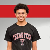 Image of a young man in a Texas Tech shirt, displaying his school pride.