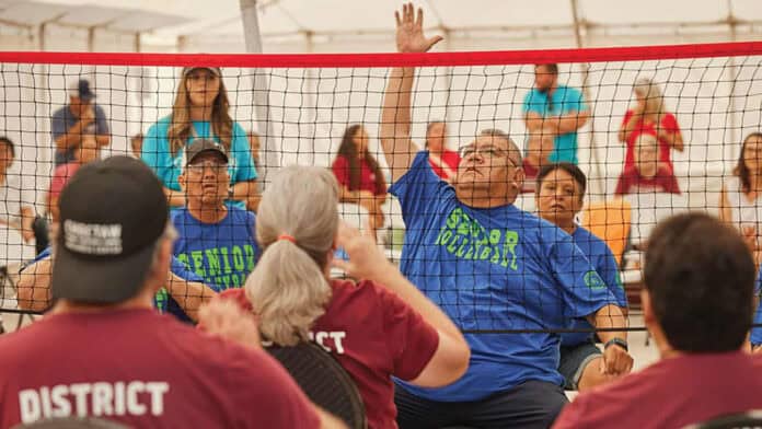 Elders play chair volleyball