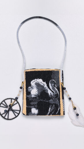 Traditional beaded purse with a white swan on a black background by Deana Ward