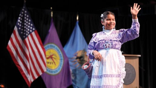 A princess contestant waves to the crowd.