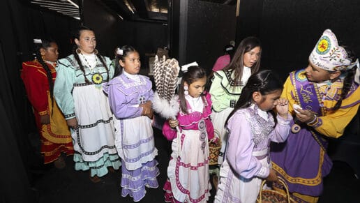 Princess pageant contestants line up backstage.