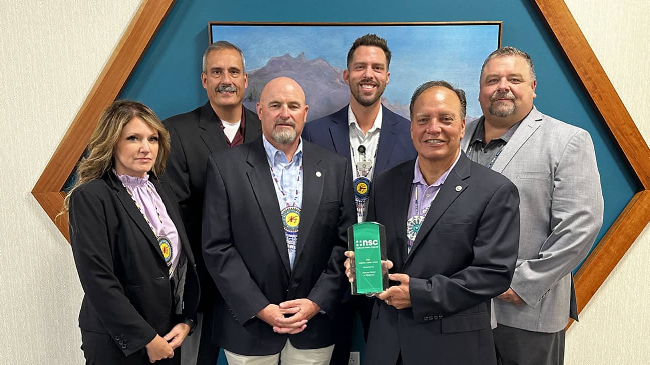 Front Row left to right: Safety Director Occupational Safety & Health Crystal Battles, Senior Executive Officer Legal and Compliance Brian Danker, Chief Gary Batton (displaying the award). Back Row Outside left to right: Assistant Chief Jack Austin, Jr., Senior Director of Safety Drea Matson, Executive Director of Risk Management Daron Sharp.