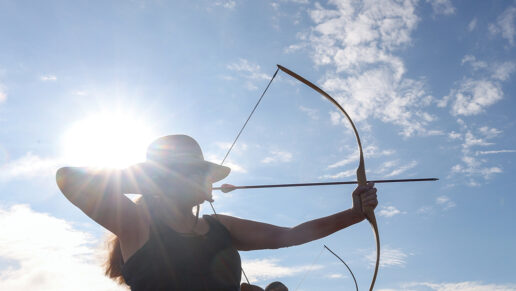 Competitors take aim at different-sized targets and practice before their respective heat of the traditional bow shoot.