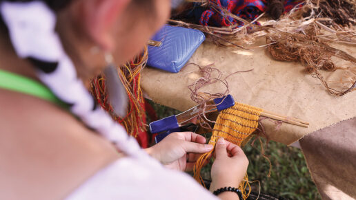 Georgia Harjo demonstrates textile weaving at the Choctaw Village.