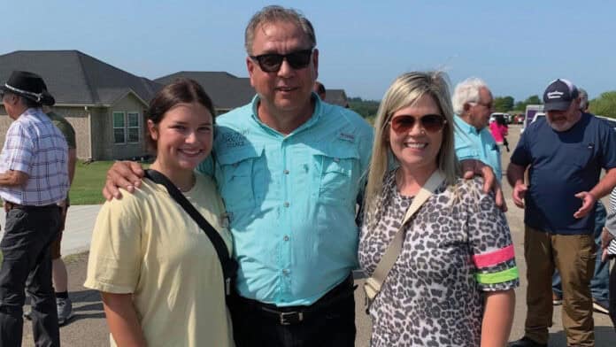 Councilman Jess Henry stands between two women for a photo.