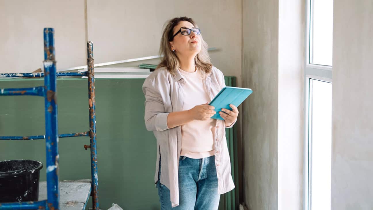 Woman assessing for lead in a home.