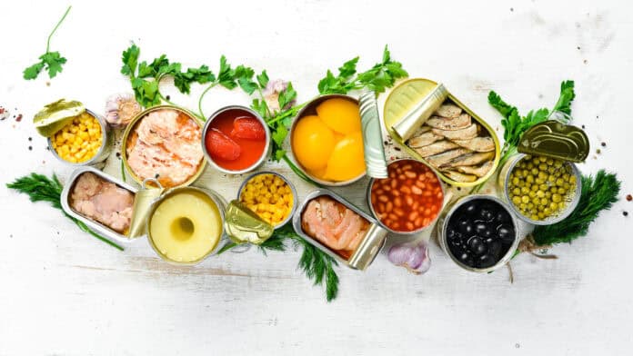 Various canned goods opened displayed on a table