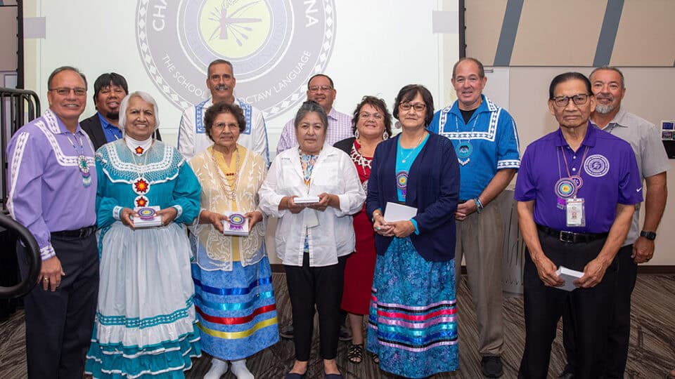 Chahta Anumpa Aiikhvna graduates pose for the camera.