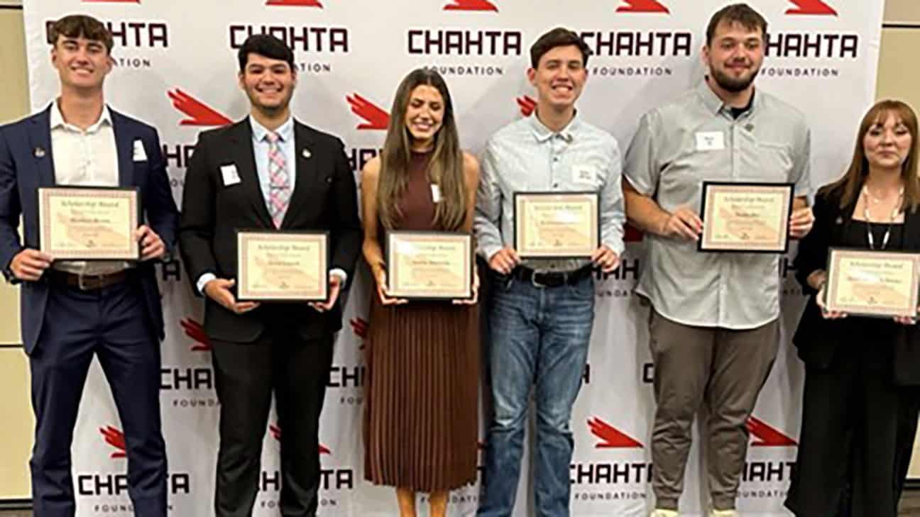 Chahta Foundation Scholarship Recipients pose holding awards.