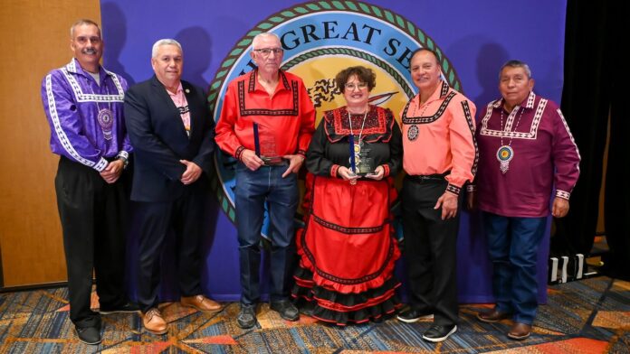 Tribal leaders pose with the winners of the 2024 Outstanding Elders. Pictured left to right: Assistant Chief Jack Austin, Jr., Tribal Council Member Eddie Bohanan, Jerry Bohanan, Gina Self, Chief Gary Batton, and Tribal Council Member Perry Thompson.