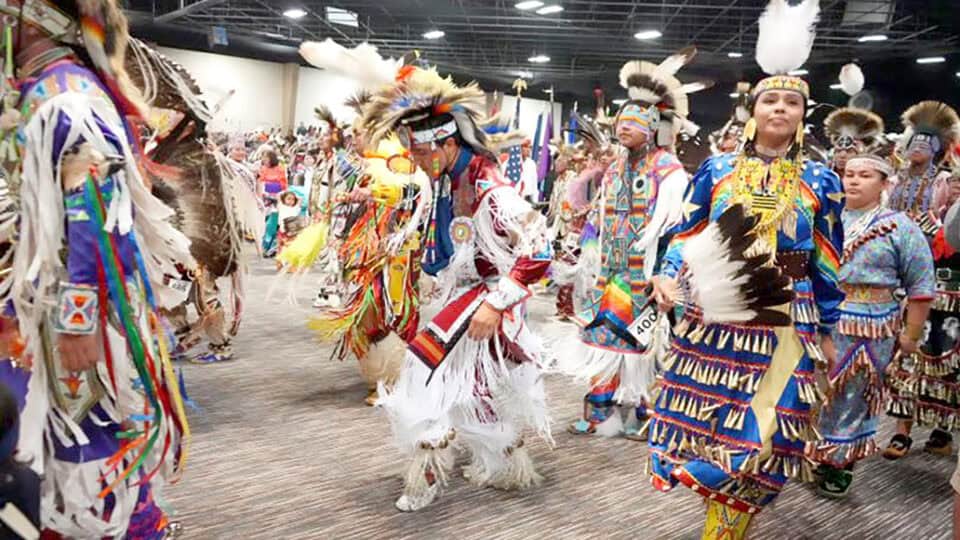 Powwow dancers fill the floor.