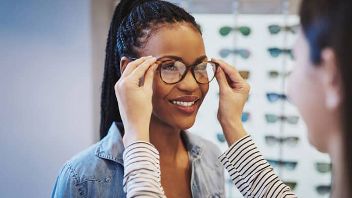 A women is being checked for fitment of new glasses.